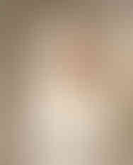 Woman styling scarf as head wrap with white outfit