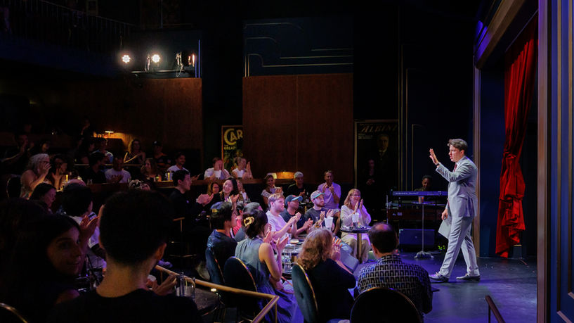 Corporate event audience watching a live magic performance by Matt Szat