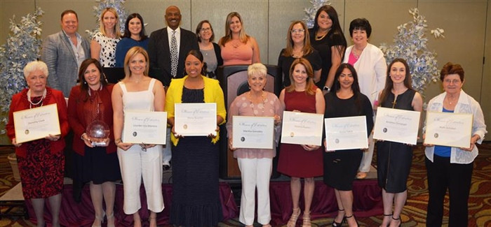 Ruth is the first person on the right, in the first row.