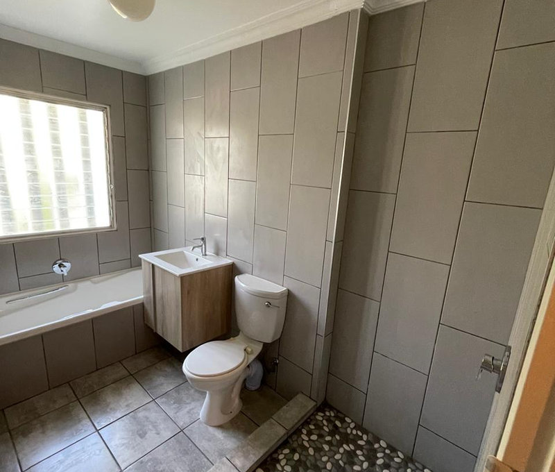 Modern bathroom installation with designer tiling