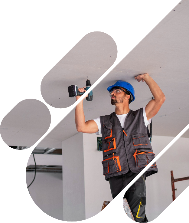 Skilled drywall contractor installing drywall sheets with precision and expertise.