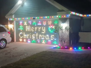 Door with moving lights spelling Merry Christmas