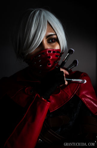Cinematic portrait by hawaii photographer Grant Uchida capturing a masked cosplayer in red and black attire, striking a poised and dramatic pose