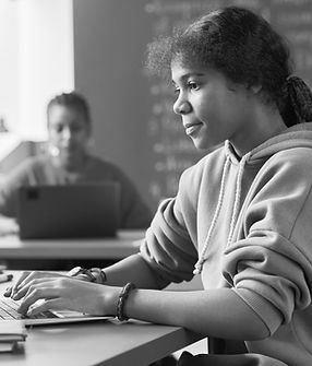 Schoolgirl using laptop in her study_edi