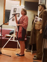 Dorata Preda, Vice Consul representing Polish Consulate Guest speaker for Exhibiition Opening. Uniforms in the background from Polish Land Army and Airforce