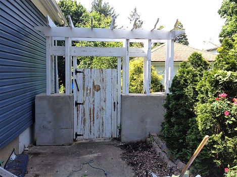 Image of gate and wall in need of painting