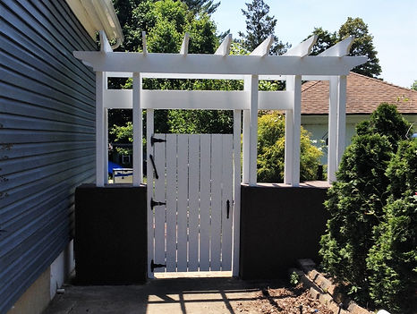 Image of gate and wall after being painted