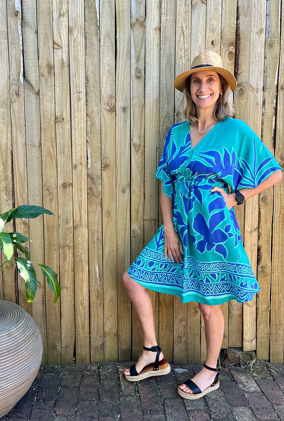 Thumbnail: Woman wearing viscose printed dress with flared skirt and pockets and bell sleeves. Blue printed breathable fabric.