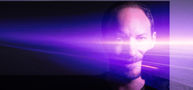 Man with a beam of light streaming across his face