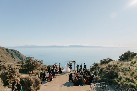 Coastal cliff wedding ceremony overlooking ocean, perfect for Wellington venues.
