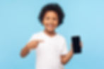 kid holding iphone smiling