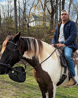 James Tocci on a horse, warehouse associate and delivery driver