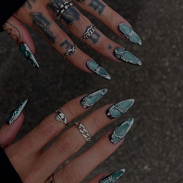 Nail sizing guide link featuring green marble luxury press-on nails with chrome silver abstract detailing.
