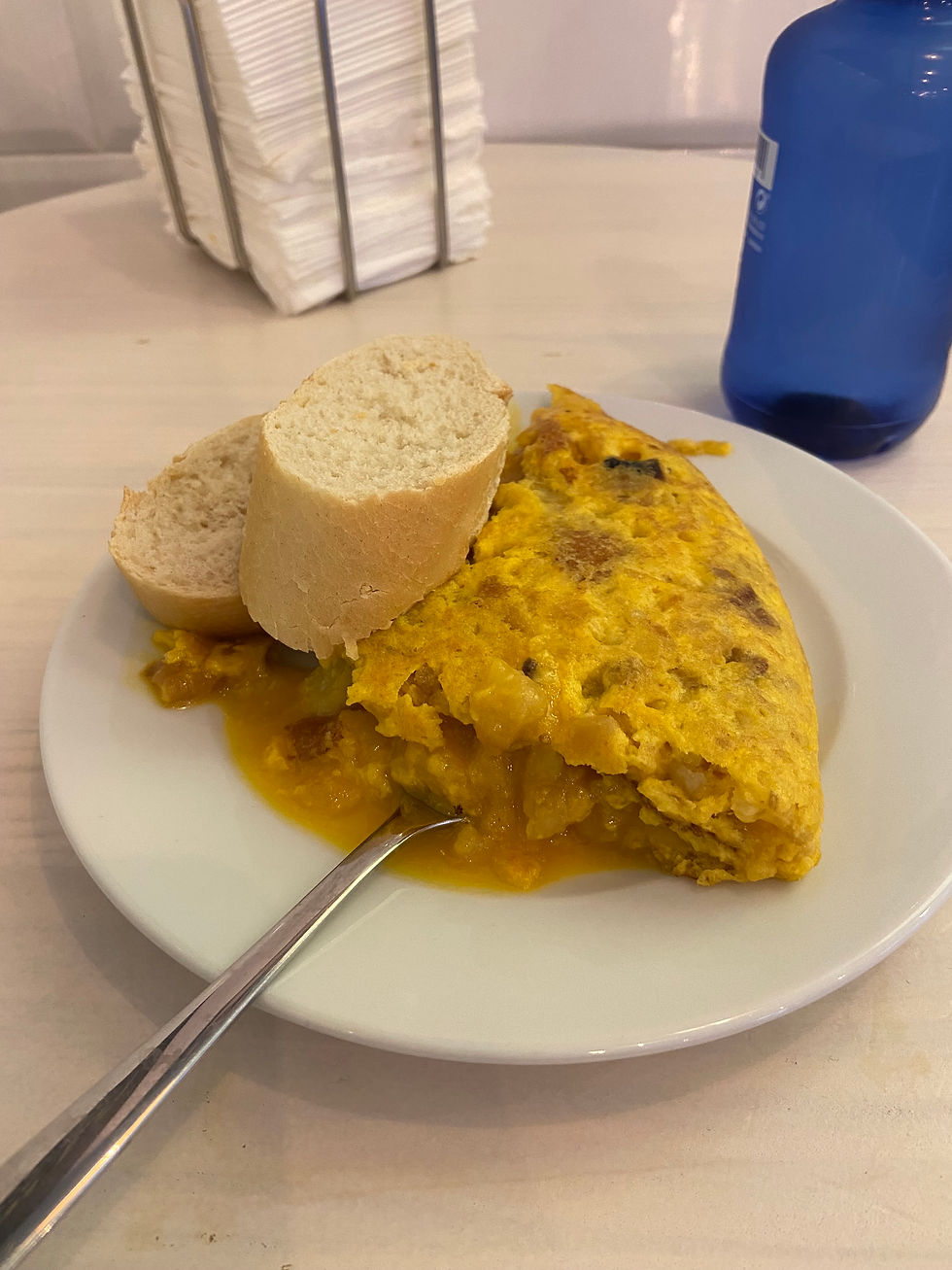 Creamy Spanish tortilla with onions cut open to reveal its runny center