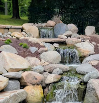 Backyard three-tiered waterfall. Water garden by Majestic Watergardens Indiana.