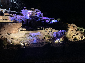 light blue LED light waterfall at night