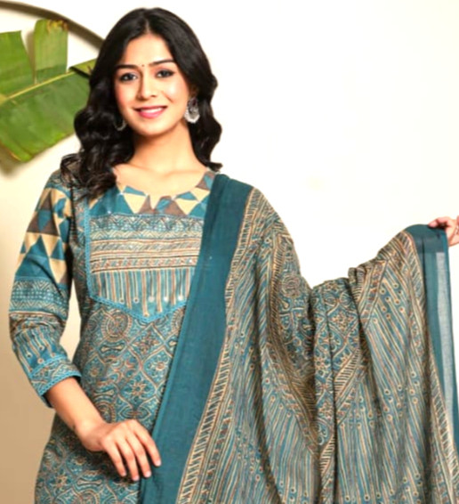 “Cotton Exclusive's Teal pure cotton salwar suit with geometric-floral kurta, tapered pants, and bordered dupatta .