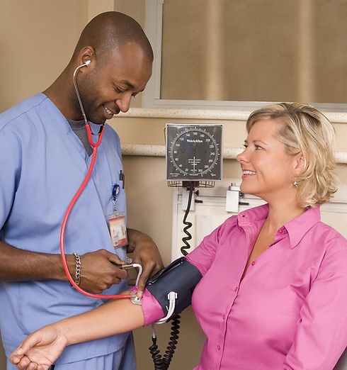 15411-a-male-nurse-taking-a-womans-blood