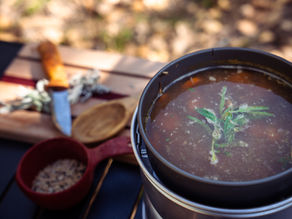 Pheasant soup, garnished with sage and in a Trangia Pot