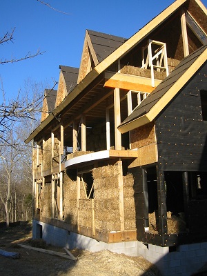 strawbale infill wraps around a structural skeleton