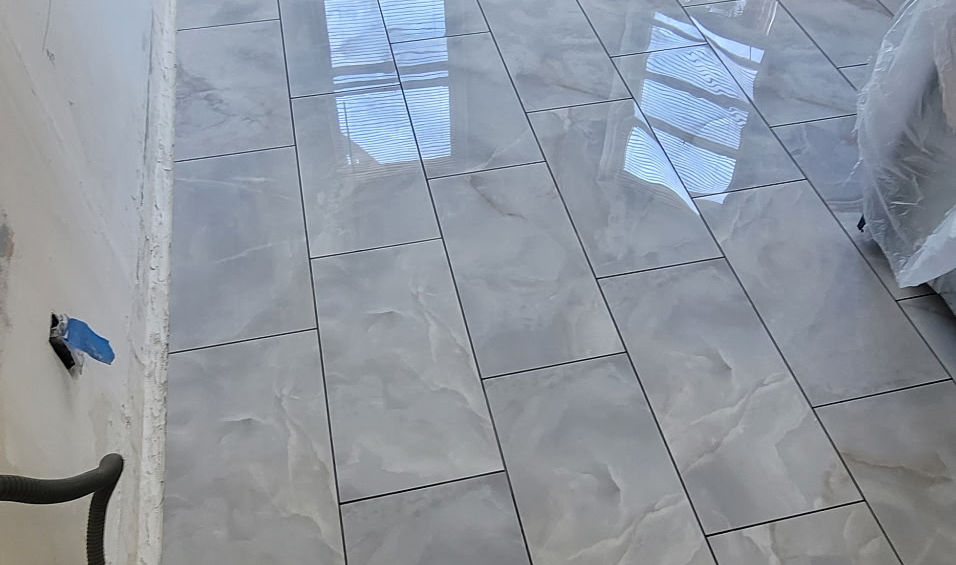 New light gray tile flooring in a room