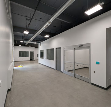 Interior view of a modern building with gray and white walls.