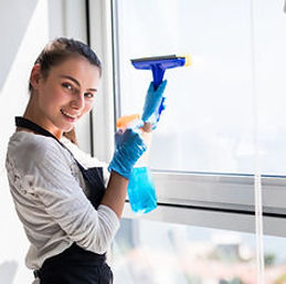 people-housework-housekeeping-concept-happy-woman-gloves-cleaning-window-with-rag-cleanser