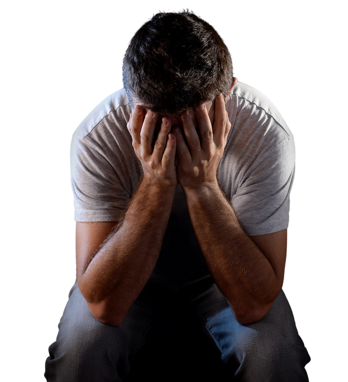 Upset man with his face in his hands