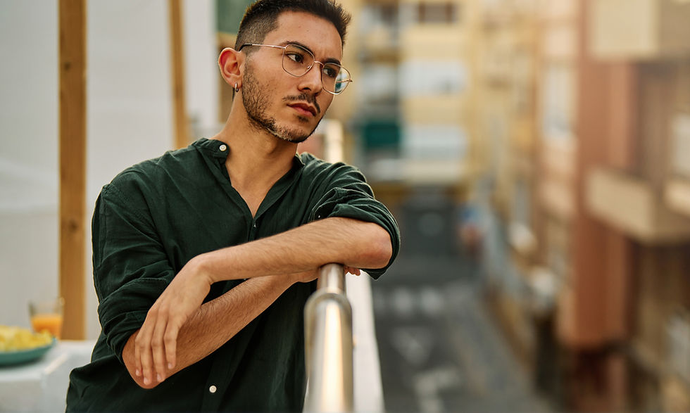 Man looking thoughtful, considering starting therapy.