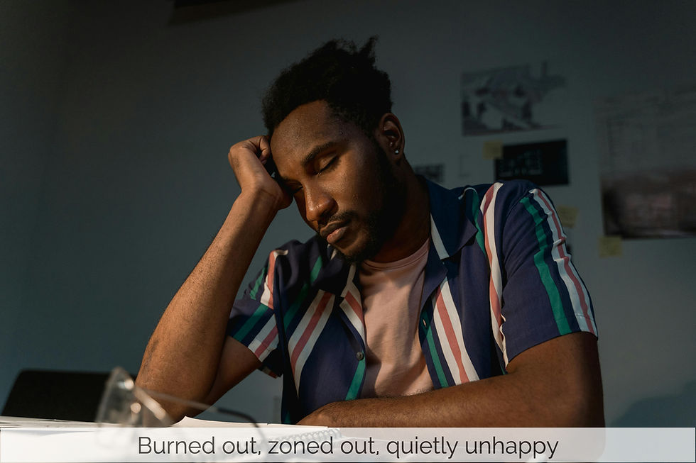 Exhausted, overwhelmed man resting his head on his hand with his eyes closed
