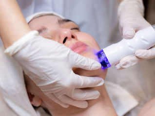 A young beautiful girl lies on the beautician's table and receives procedures