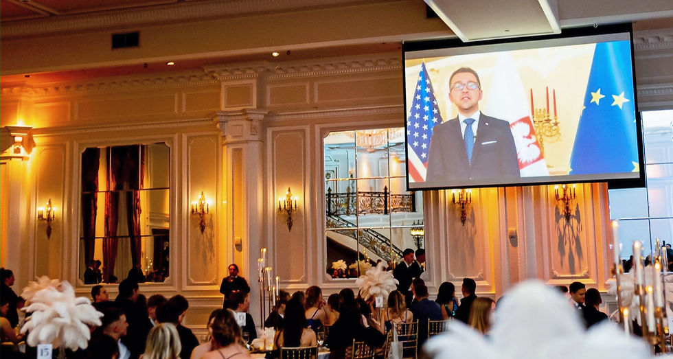 The Consul General addresses the 2025 Youth Ball attendees virtually.