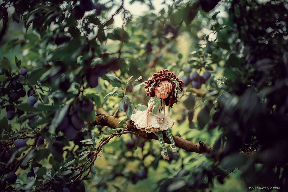 Crochet doll outdoor photoshoot in orchard