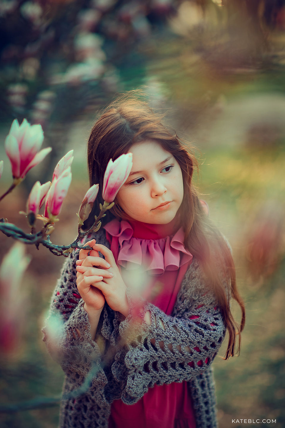 portrait of a girl with flowers in a park