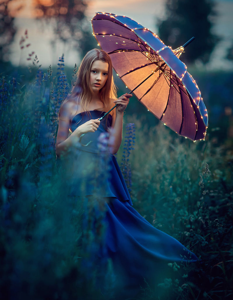 Portrait photoshoot for girl in violet dress with umbrella
