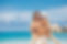 Happy couple in sunglasses piggybacking cheerful on tropical beach during summer holidays 