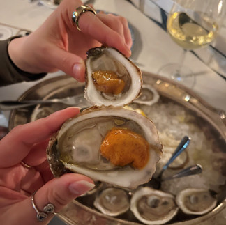 The oysters were briny and fresh, with various sauce options.