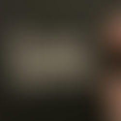 a black yoga mat with the Puppy Sphere printed on it in white, a pink water bottle and phone show, too