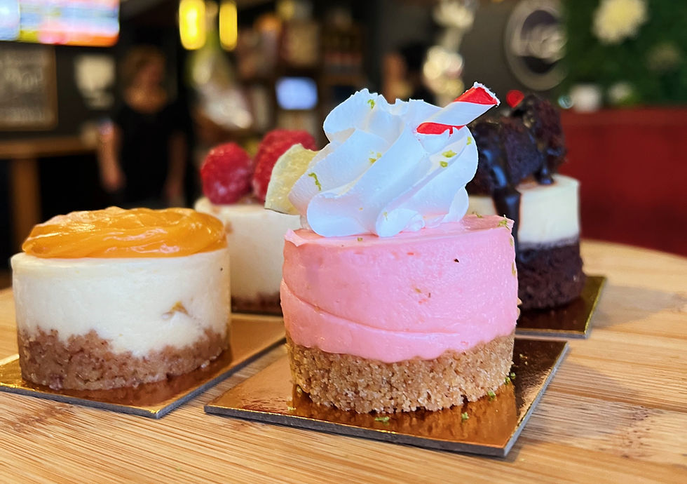 A tray of assorted mini cheesecakes