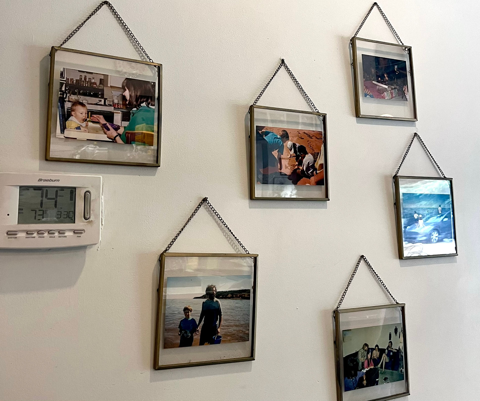 family photos dangling on the back walls