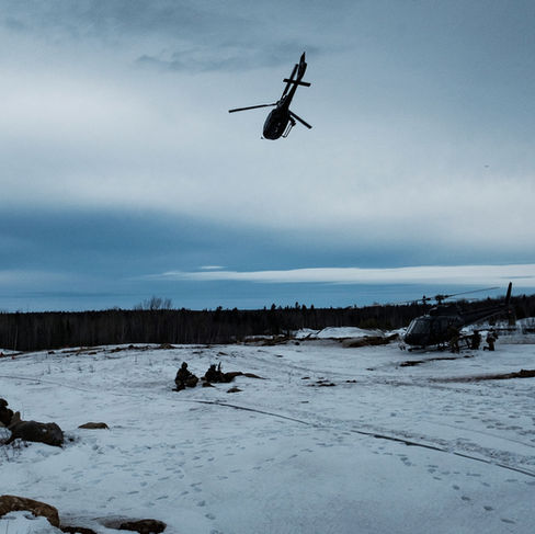 EC130 flies by as airsofters unload from helicopter