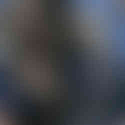 Airsoft player with rifle and black pelican case