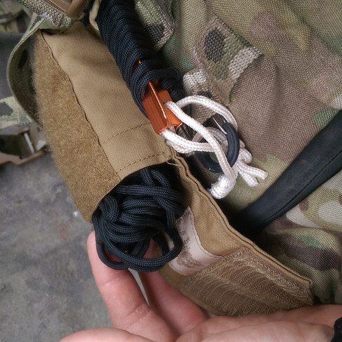 Cordage and stakes in pouch on MR 3DAP for tarp setup