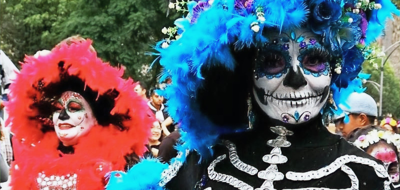 Two people dressed as Catrinas for the Desfile de Catrinas parade in Mérida