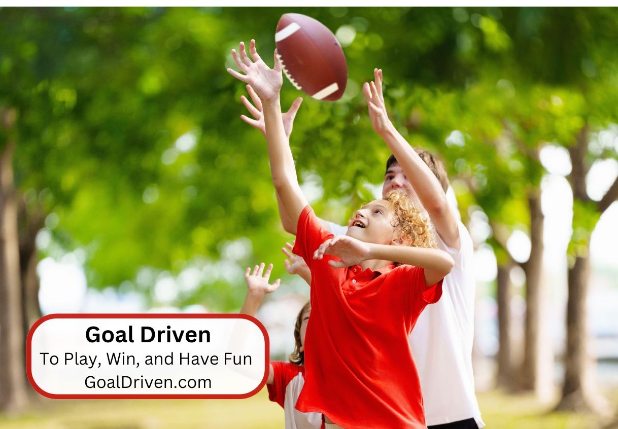 3 children playing football. Their goal is to play, win and have fun