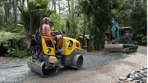 Roller from NZ Machine Hire being used on gravel road in Auckland