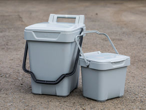 Two brown waste bins, one tall and one short, display Cannock Chase and Stafford Borough Council logos with "working together."