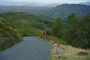 Abbie Barnes, Presenter, Filmmaker, Adventurer, cycling during the Abbie Bikes Britain Challenge in 2021. 2000 miles via every national park in the UK