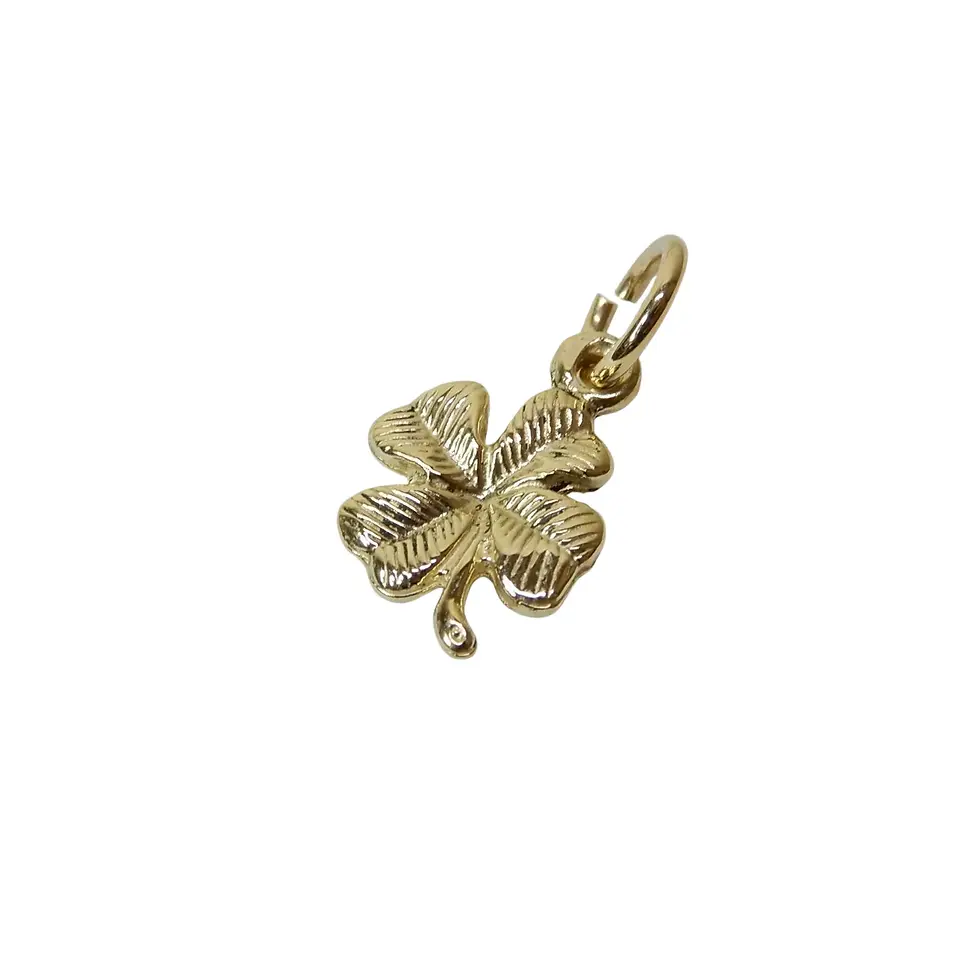 Thumbnail: Gold clover pendant charm lying flat with polished detailing