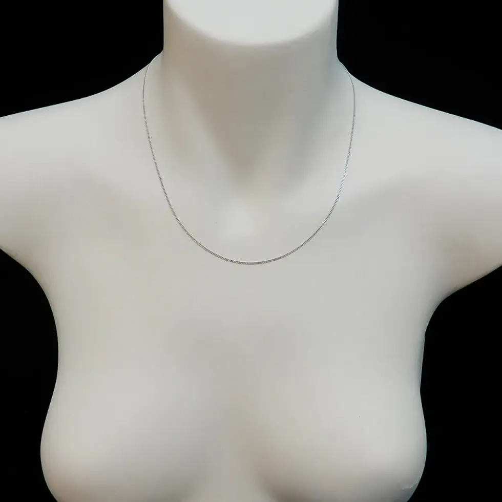 Thumbnail: Slim 1mm white gold curb chain necklace styled on mannequin bust